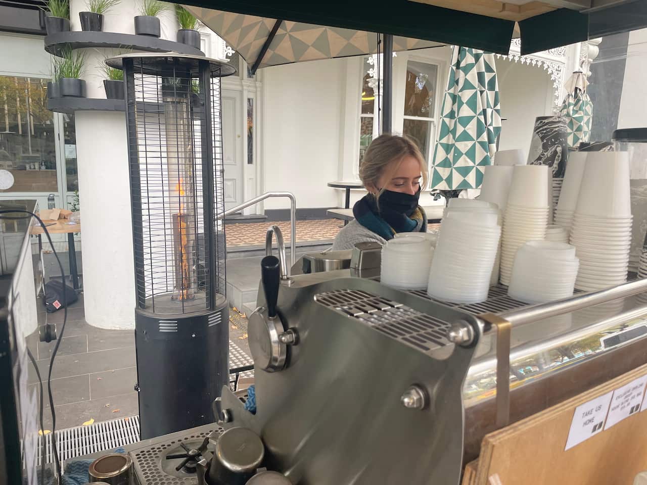 Georgia O'Sullivan, the assistant manager of The Kettle Black cafe in South Melbourne, says it has been heartbreaking to lay off staff members.