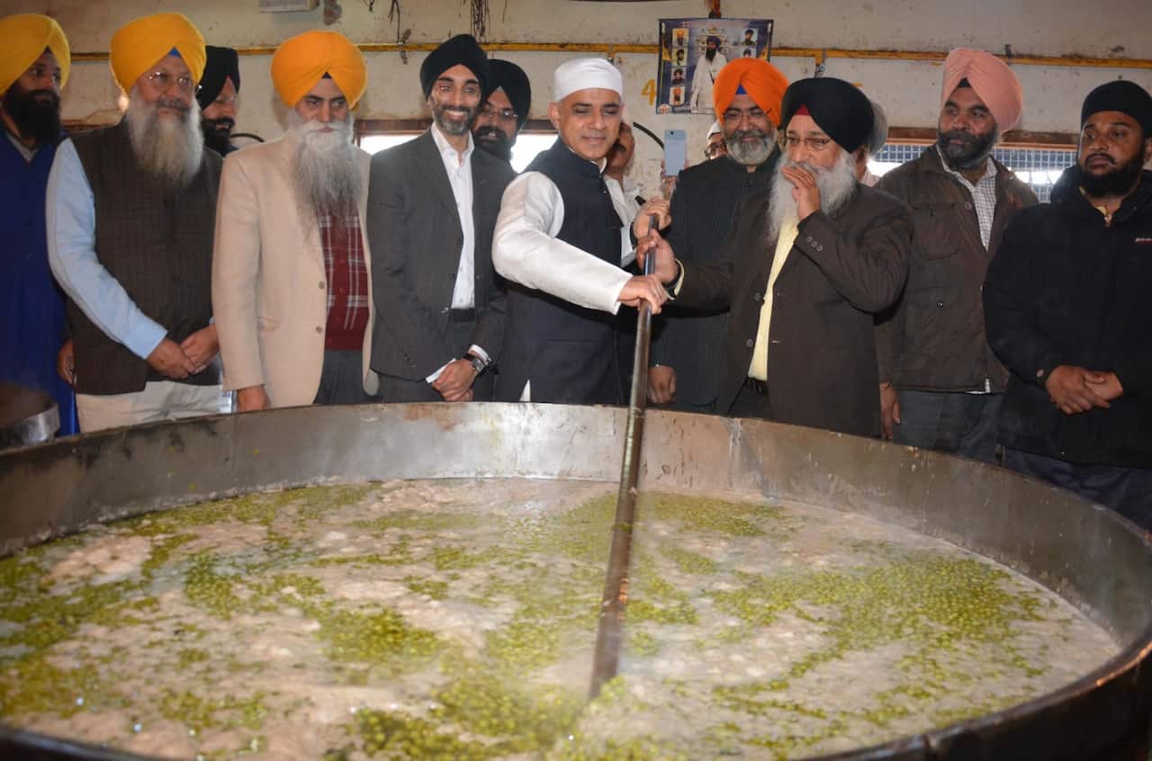 London Mayor Sadiq Khan doing sewa at Langar hall after paying obeisance at Golden Temple, on December 6, 2017 in Amritsar, India.