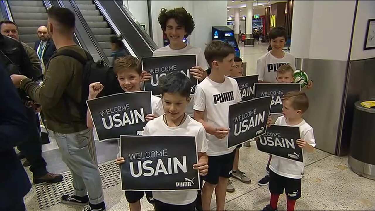 Children welcome Bolt to Australia.