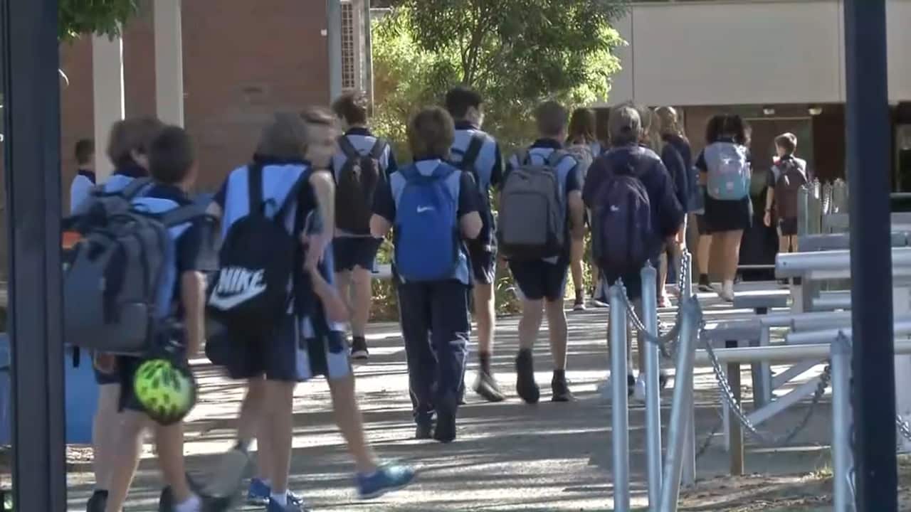 Carine Senior High School students walk in the front gates