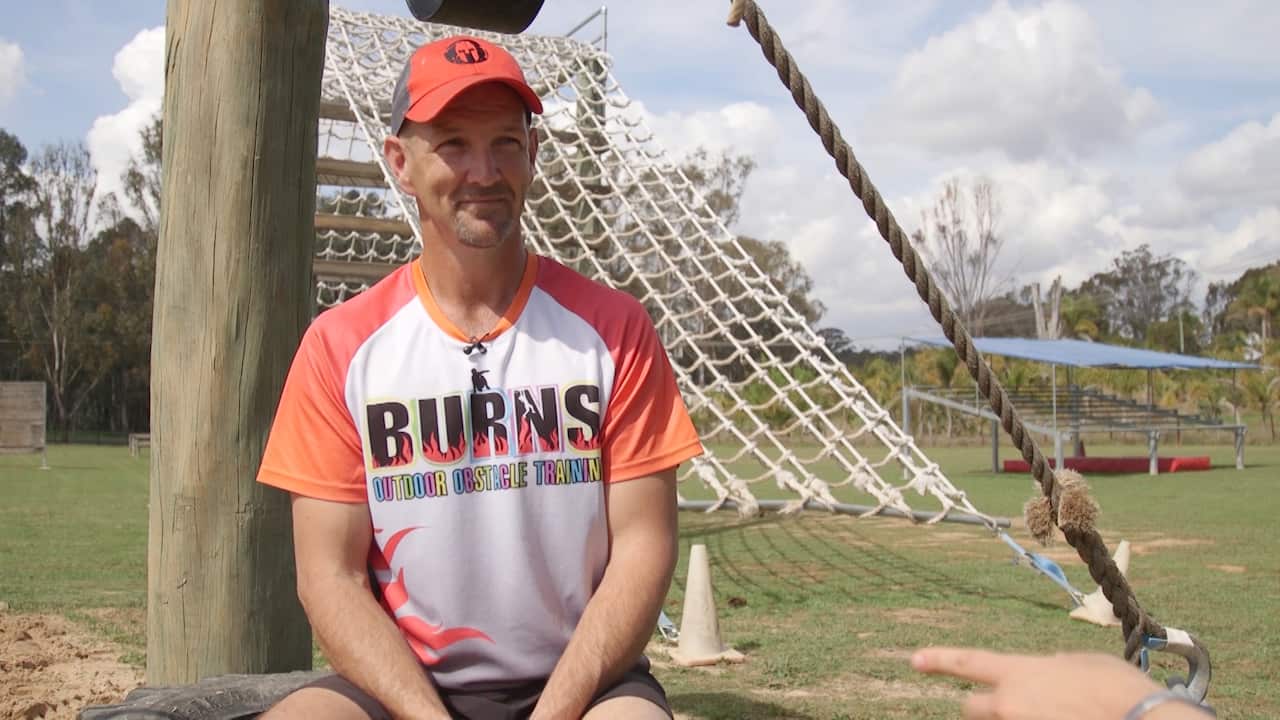 Wayne Burns says he has "a lot less money" but is extremely happy with his new life.