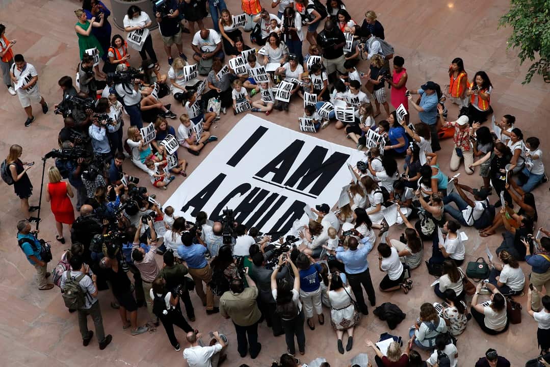 Families with young children protest the separation of immigrant families with a sit-in at the Hart Senate Office Building,