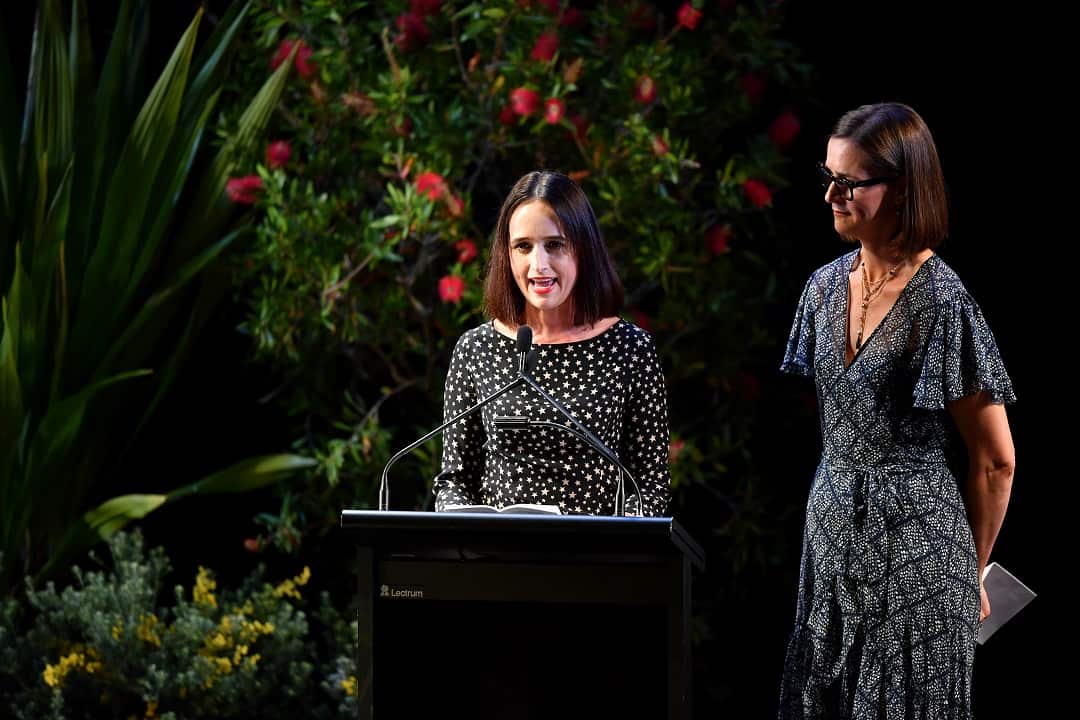 Daughters Sally Kiernan (left) and Pip Kiernan speak during the State Memorial service for Clean Up Australia founder Ian Kiernan at the Sydney Opera House in Sydney, Friday, November 16, 2018. (AAP Image/Joel Carrett) NO ARCHIVING