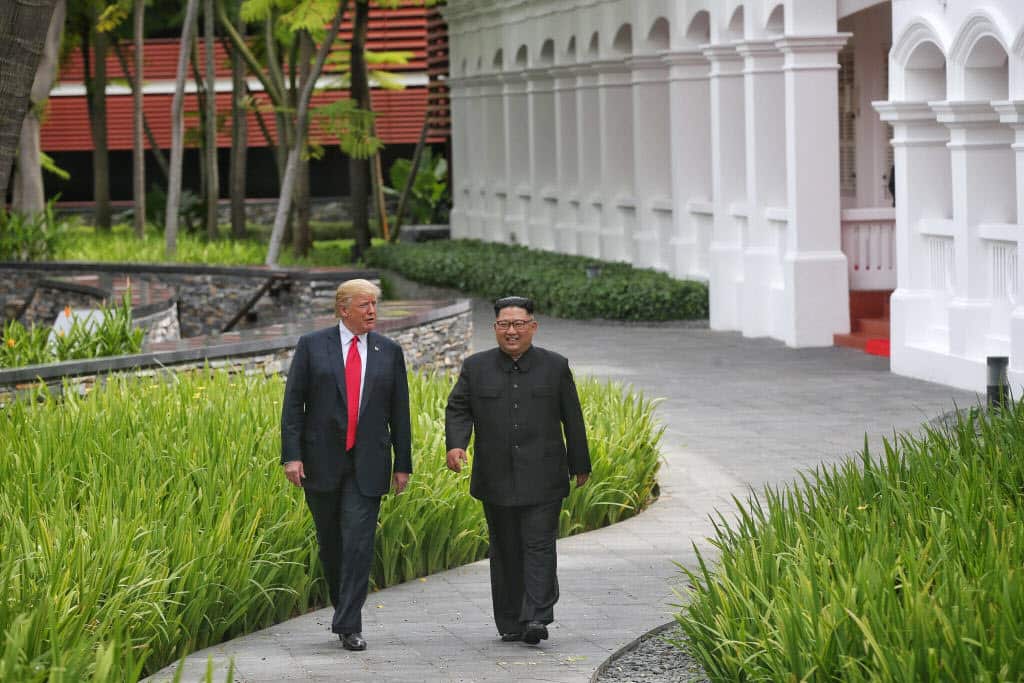US President Donald Trump (L) with North Korean leader Kim Jong-un (R).