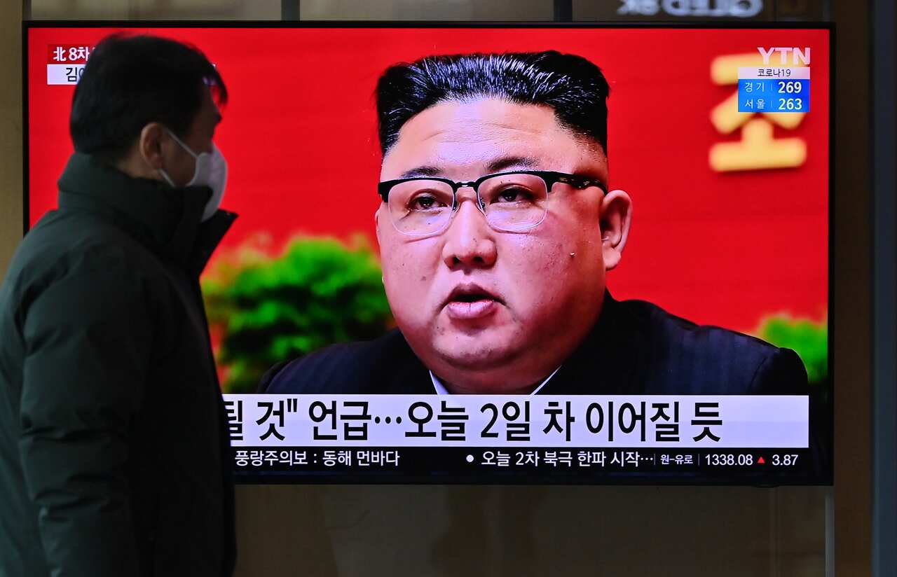 A man watches a television screen showing news footage of North Korean leader Kim Jong Un in Seoul, Korea.