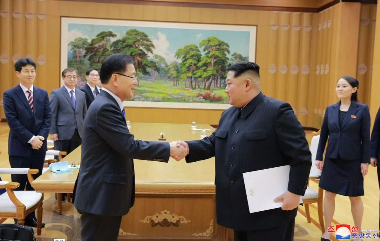 North Korean Leader Kim Jong Un (right) shakes hands with South Korea's Head of National Security Chung Eui-Yong.