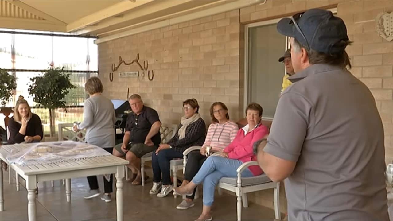 Residents gather to discuss the issue.