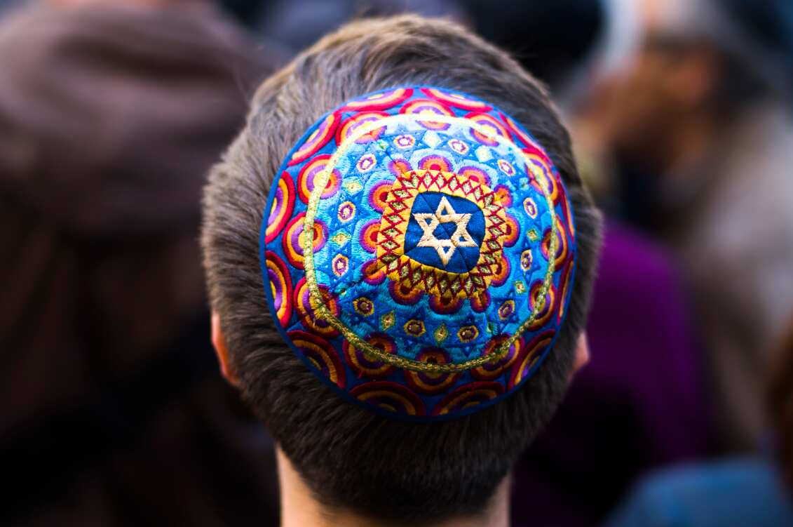 A man wears a Jewish skullcap, as he attends a demonstration against an anti-Semitic attack in Berlin on Wednesday.