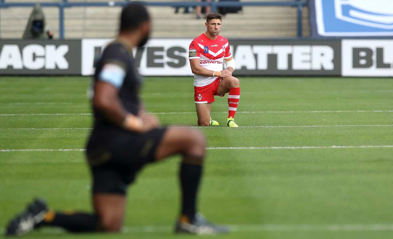 St Helens' Tommy Makinson takes a knee in support of the Black Lives Matter Movement during the Betfred Super League match at Emerald Headingley Stadium. 
