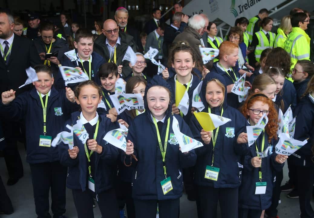 Students from St Patrick's National School, Cloonlyon wait the arrival of Pope Francis.