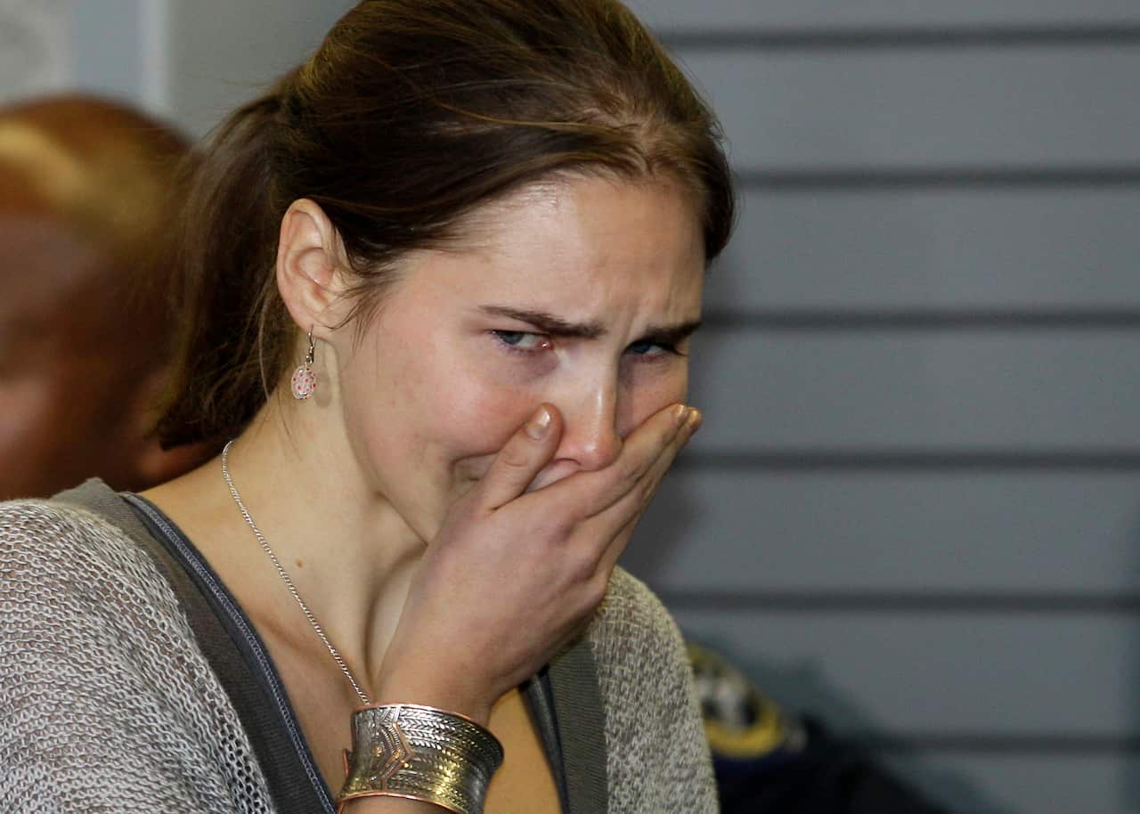 Knox breaks down in tears as she speaks with reporters upon her arrival back in Seattle in 2011.