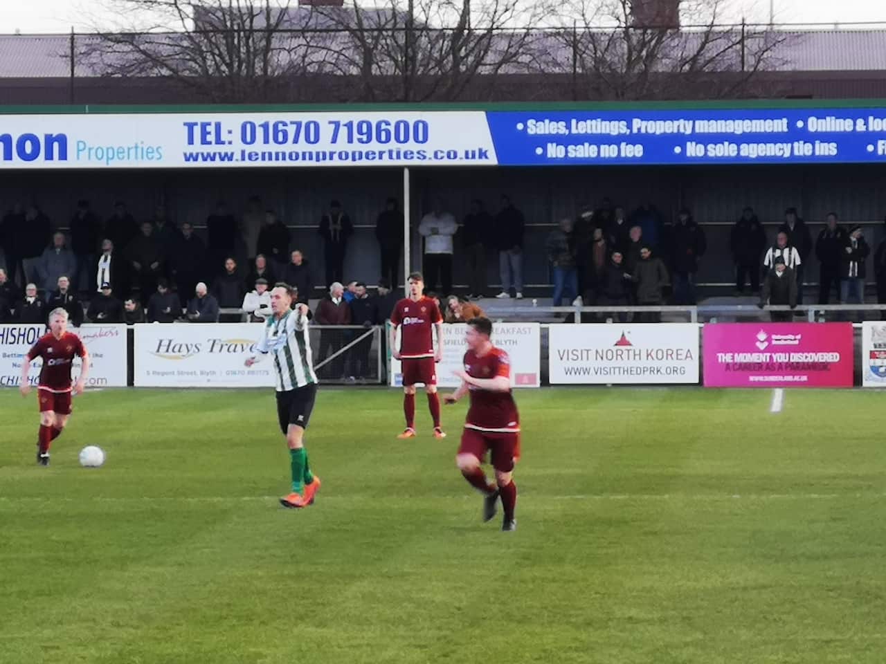 Football fans were surprised to see a pitch-side sign urging them to head to North Korea.