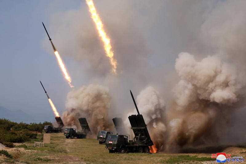  A photo released by the official North Korean Central News Agency (KCNA) shows North Korean rocket launchers firing during a 'strike drill'.