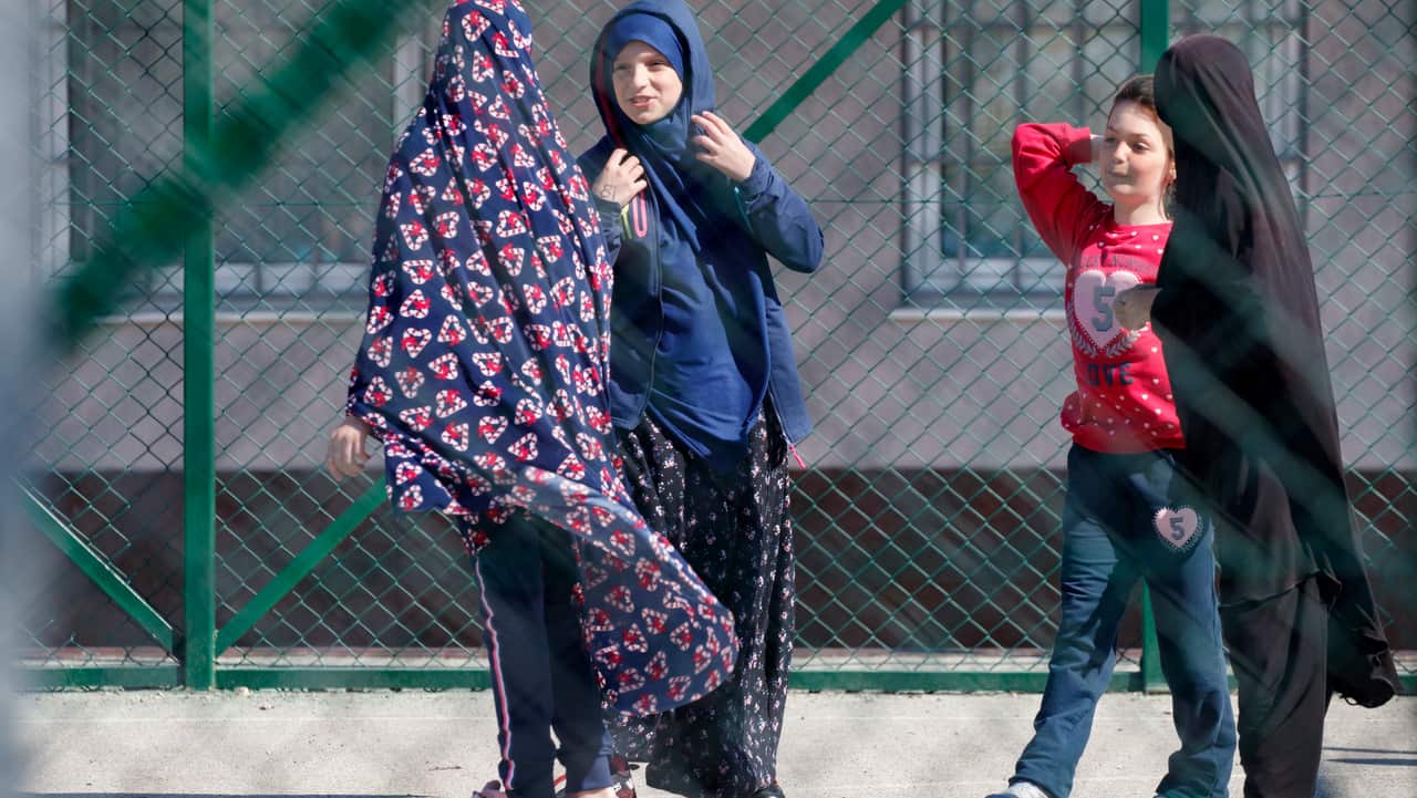 Children play inside the compound of the foreign detention center in the village of Vranidoll, Kosovo.