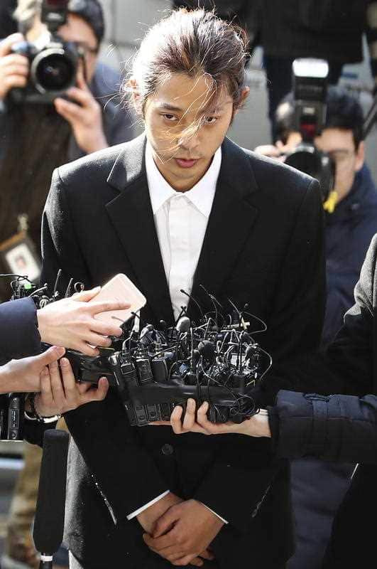 Jung Joon-young (C) talks to reporters after arriving at the Metropolitan Police Agency in Seoul, South Korea.