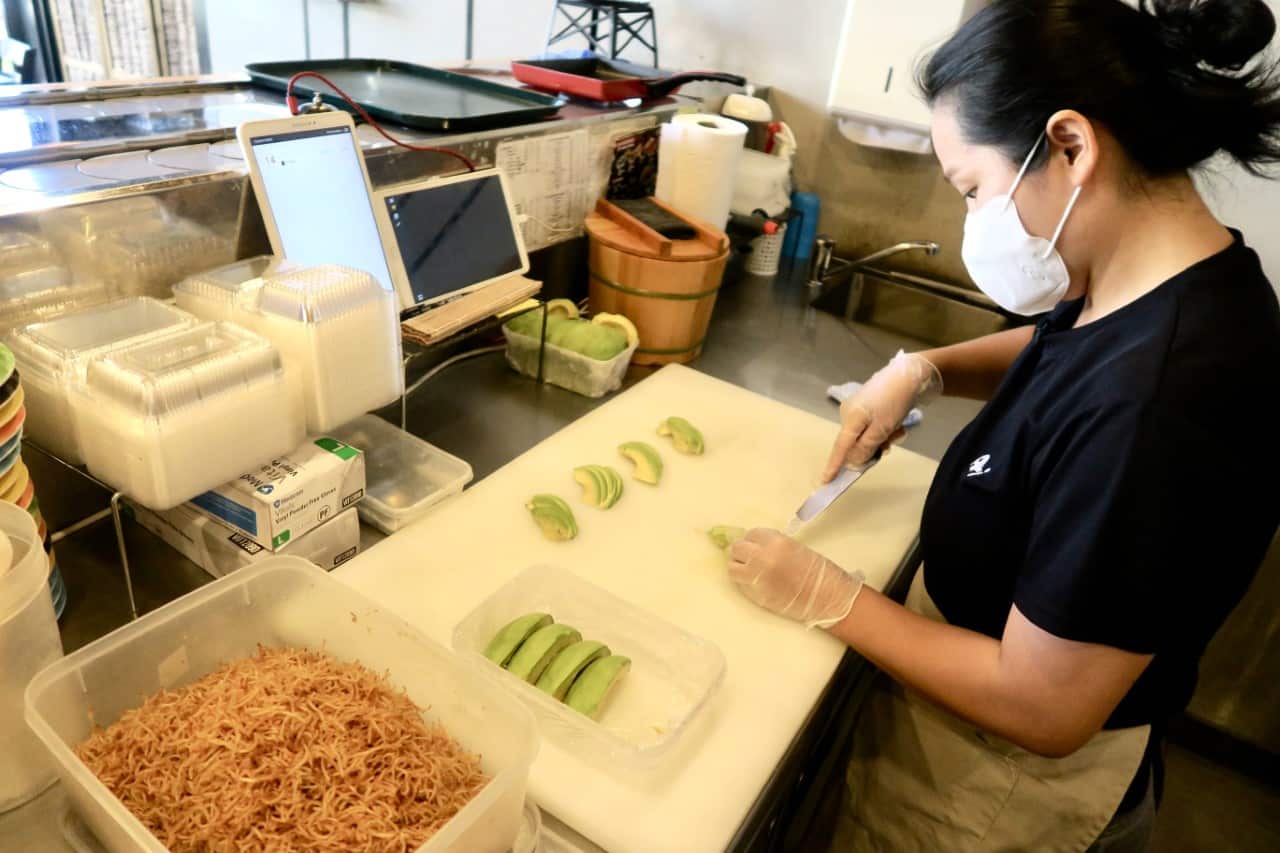 Kumhee working in her Japanese restaurant.