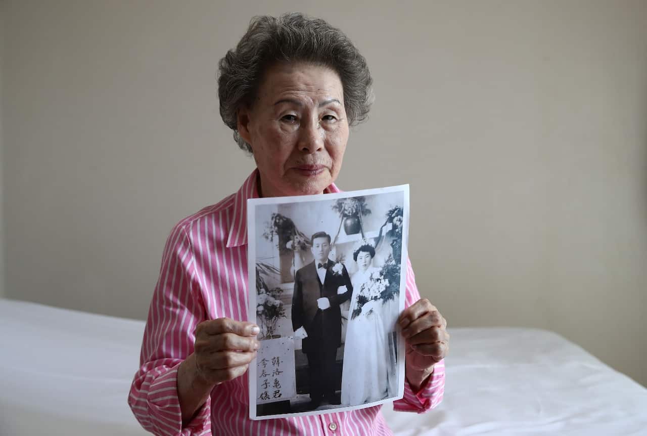 Lee Choon-Ja, 88, holds photo of her South Korean hudsband (give to her North Korean relatives during the reunion) the day before departing for North Korea 