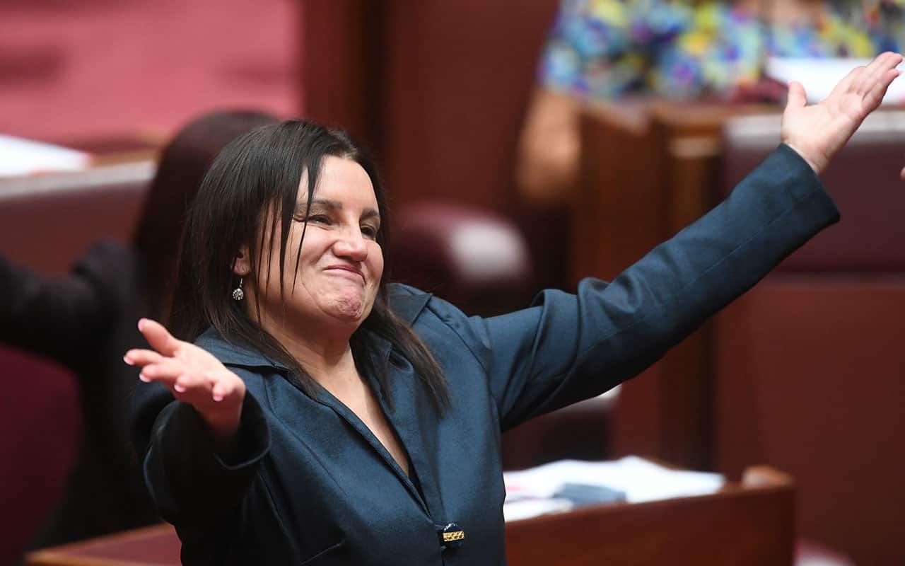 Tasmanian Senator Jacqui Lambie reacts after delivering a statement on her resignation in the Senate chamber at Parliament House in Canberra.