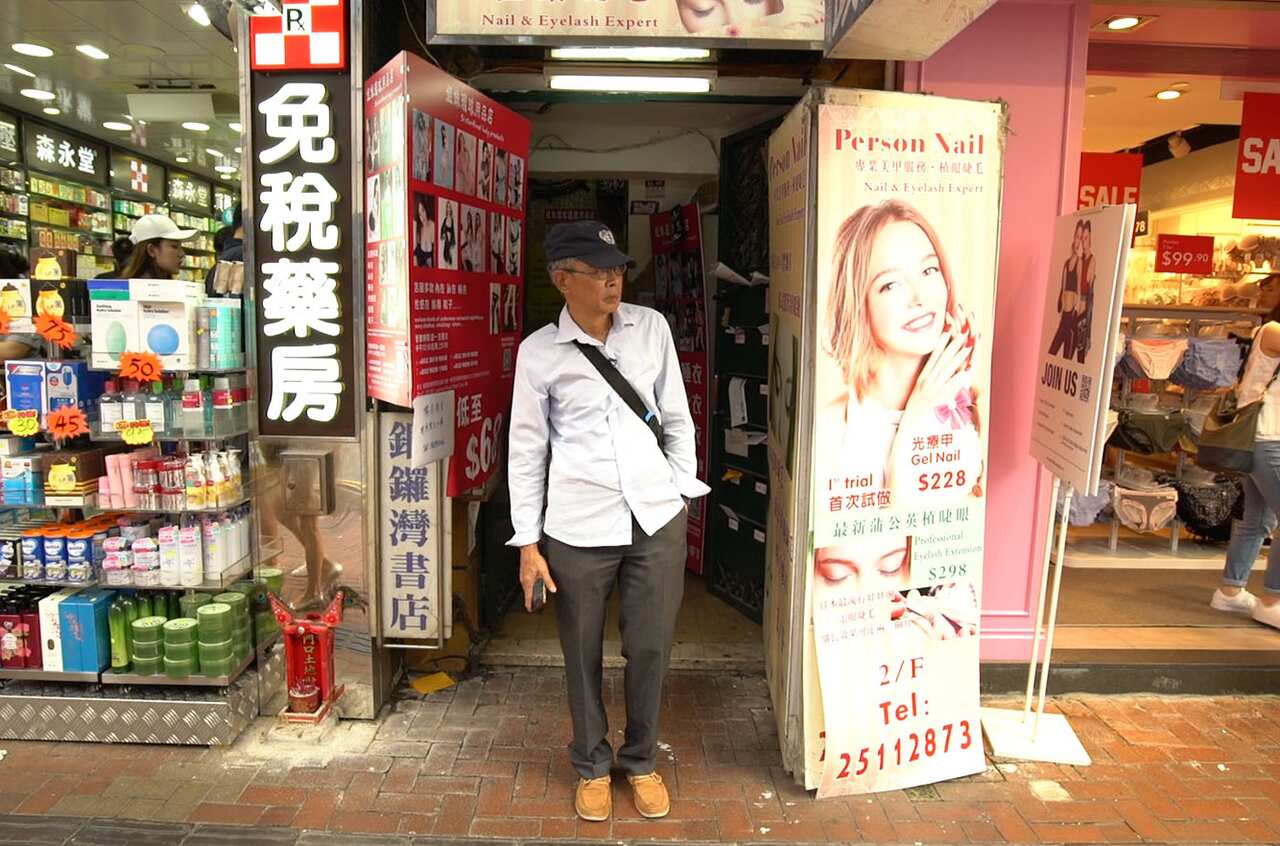 Bookseller Lam Wing-Kee outside his closed store