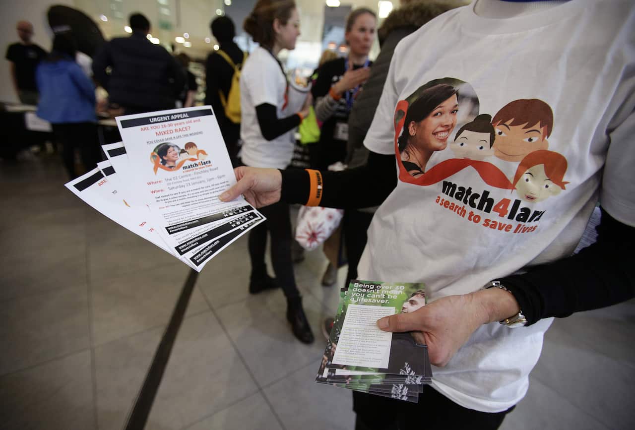 People handing out leaflets during the blood cancer charity.