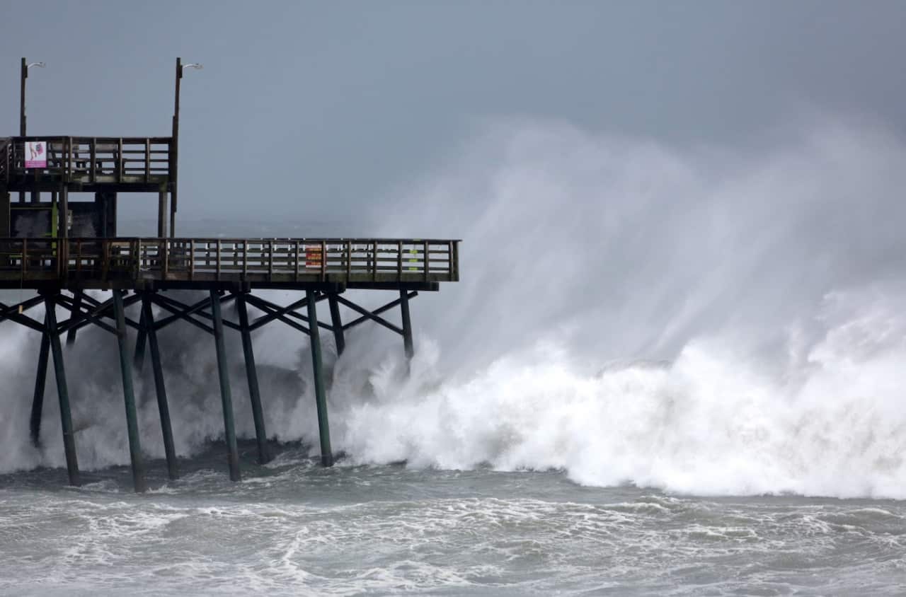 Waves from Hurricane Florence pound the Bogue Inlet Pier in Emerald Isle N.C., Thursday, Sept. 13, 2018. 