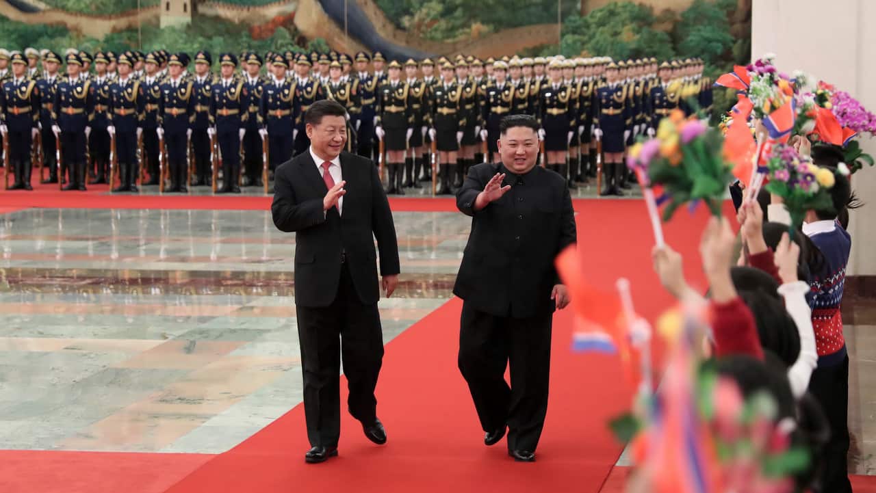 North Korean leader Kim Jong Un is cheered by children during a welcome ceremony in Beijing held by Chinese President Xi Jinping on 8 January, 2019.