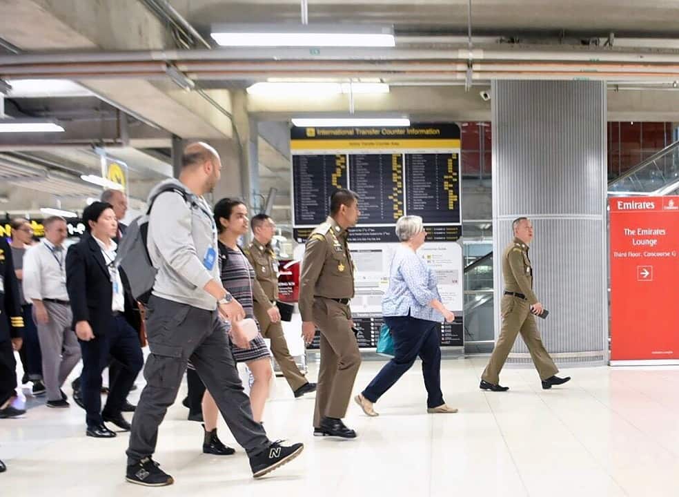 Rahaf Mohammed al-Qununbeing is accompanied by Thai Immigration Police Chief to board a flight departing Suvarnabhumi Airport.