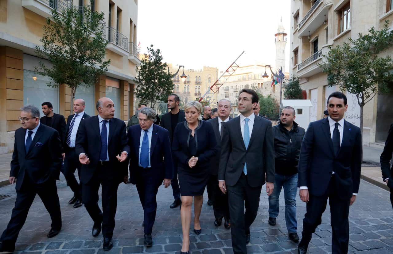 Lebanese Governor of Beirut Ziad Shabib (C-R) with with the leader of France's far-right Front National political party on February 20 (AAP)