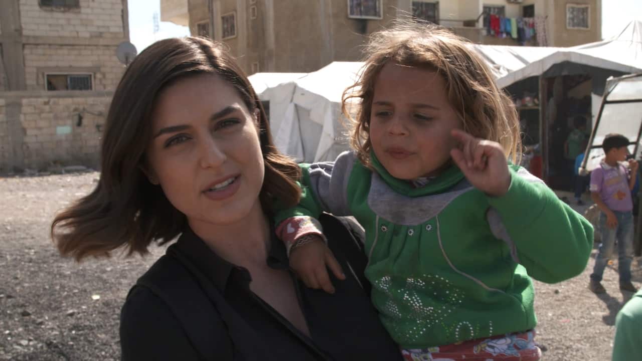 Sarah Abo and Khadija, a young Syrian refugee.