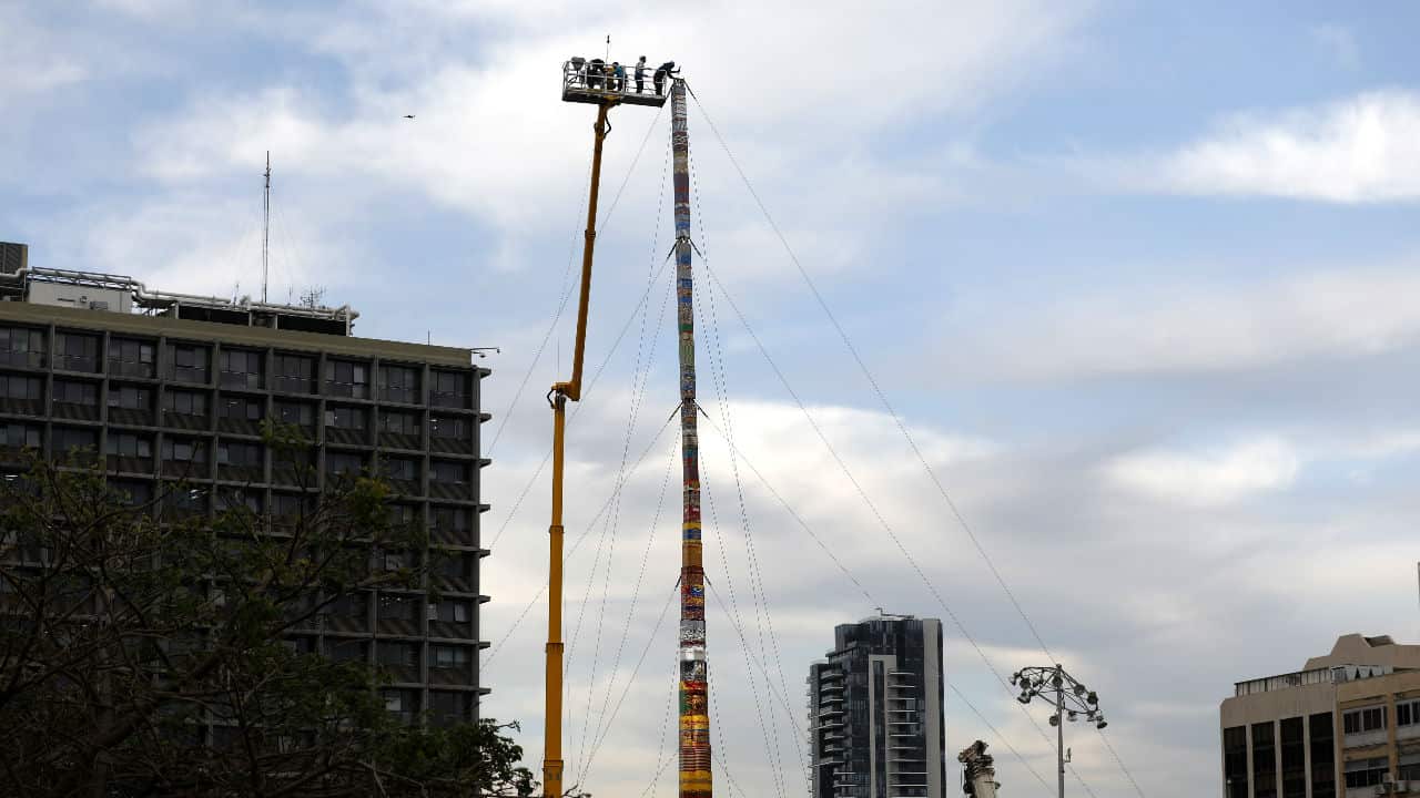 Workers build the Lego Tower.