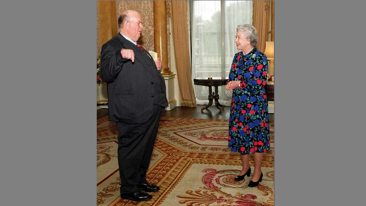 Les Murray in 1999 received a gold medal for poetry at Buckingham Palace from Britain's Queen Elizabeth II.