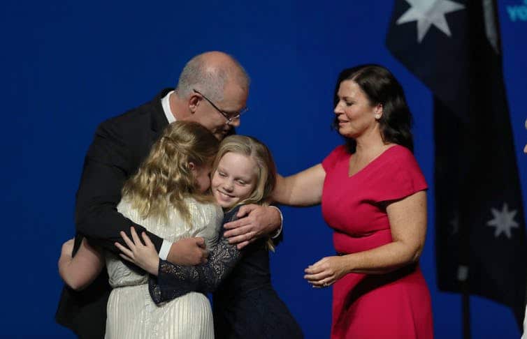 The PM embraces his family at the Liberal Party campaign launch.