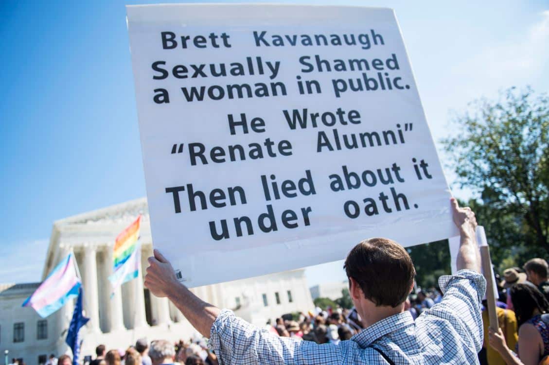 Protesters opposed to Supreme Court nominee Brett Kavanaugh rally at the Supreme Court .
