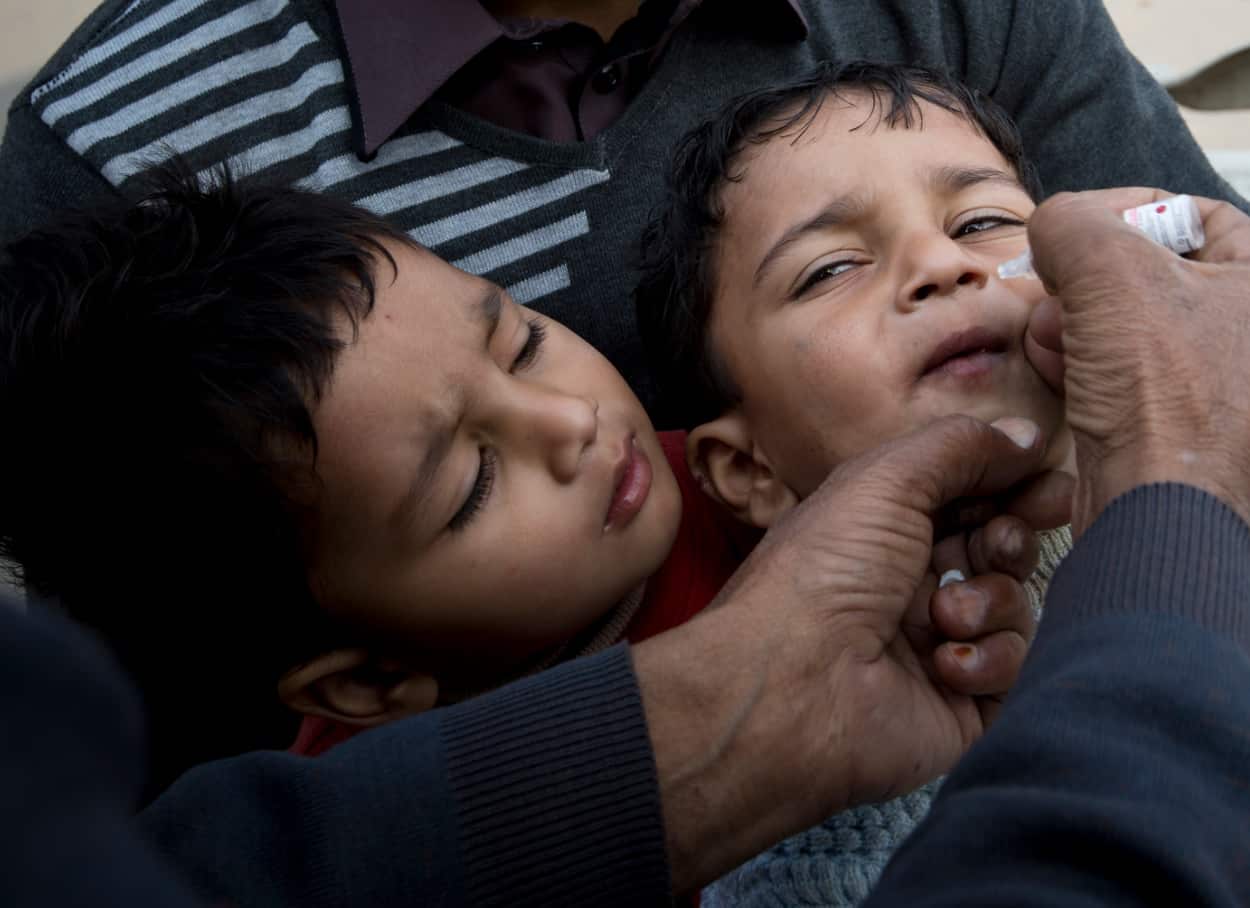 A health worker gives a polio vaccine to a child days after Pakistan launched an anti-polio campaign across the country (AAP)