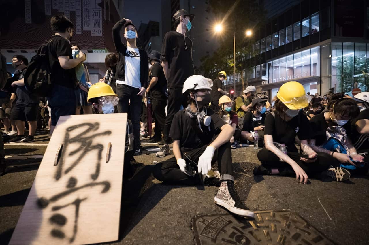 Protesters with the home made protective gears seen outside the police headquarters of Hong Kong.