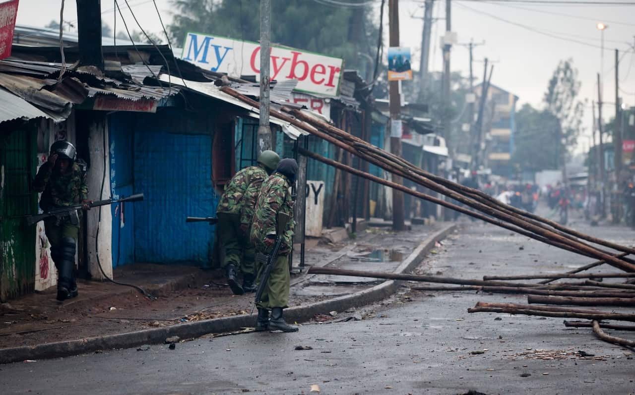 Police confront protesters in the Kibera slum in Nairobi, Kenya, Thursday, Oct. 26, 2017.