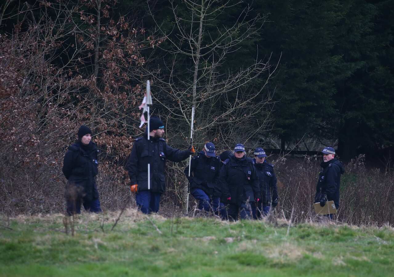 Officers from the Metropolitan Police search woodland near to Great Chart Golf and Lesiure in Ashford, Kent. 