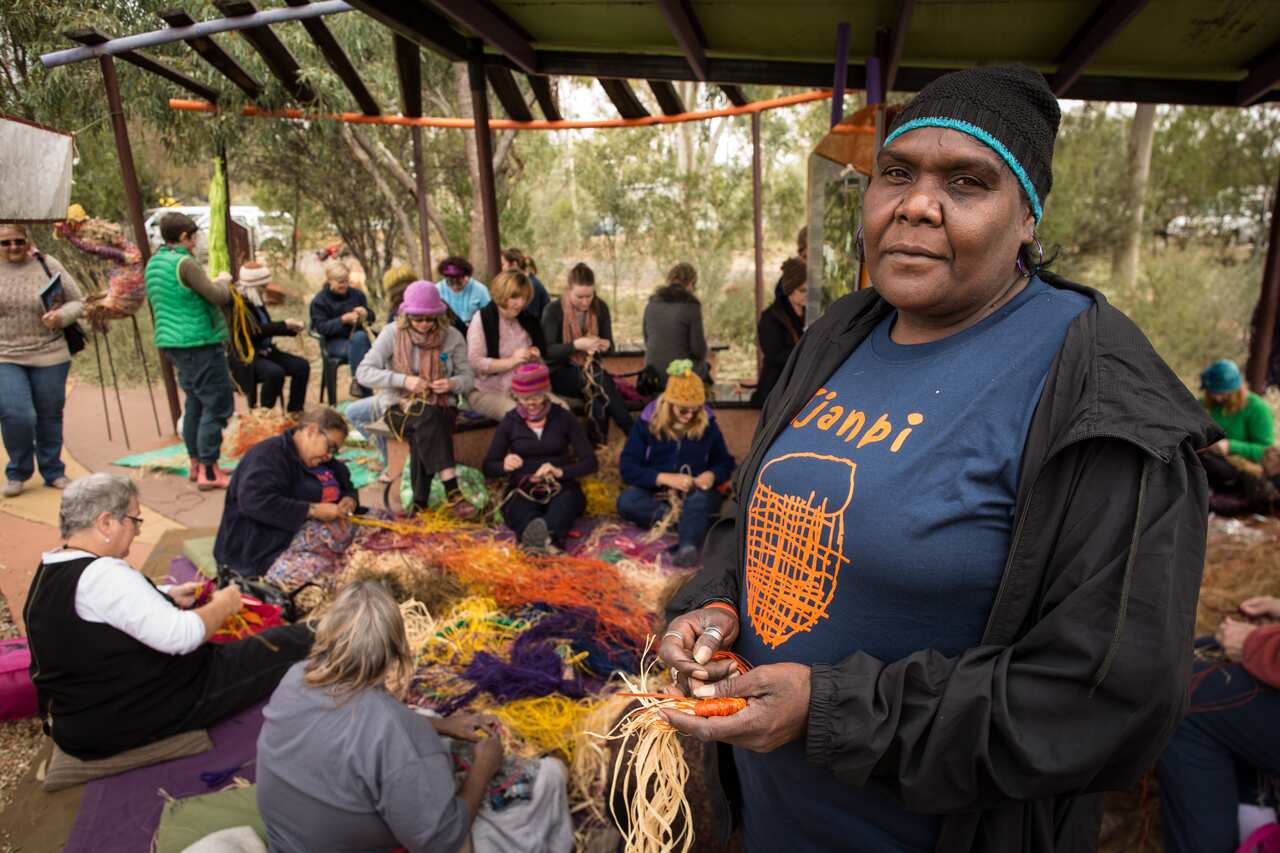 Loria Heffernan facilitating a Tjanpi weaving workshop in Ernabelle, SA.