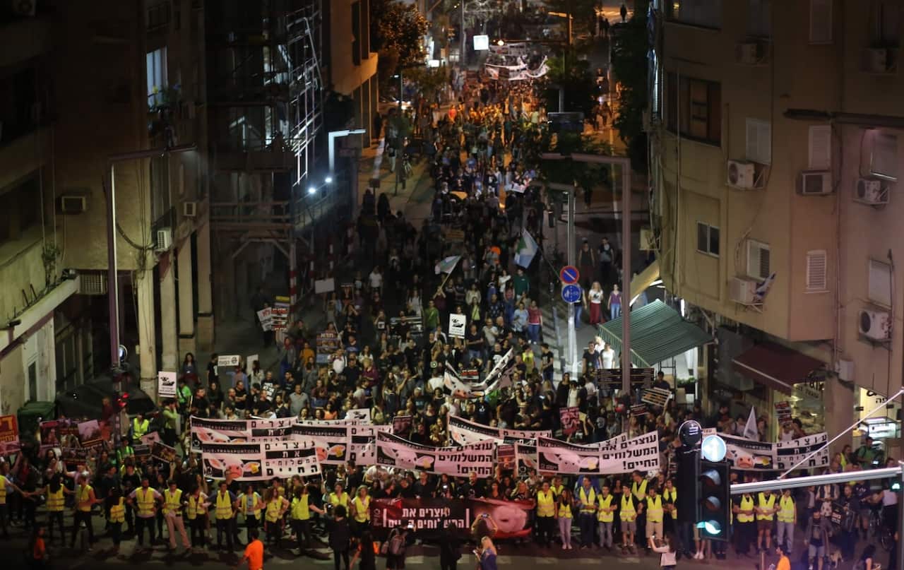 A supplied image obtained Sunday, April 29, 2018 of protestors during a rally in Tel Aviv Israel, overnight.