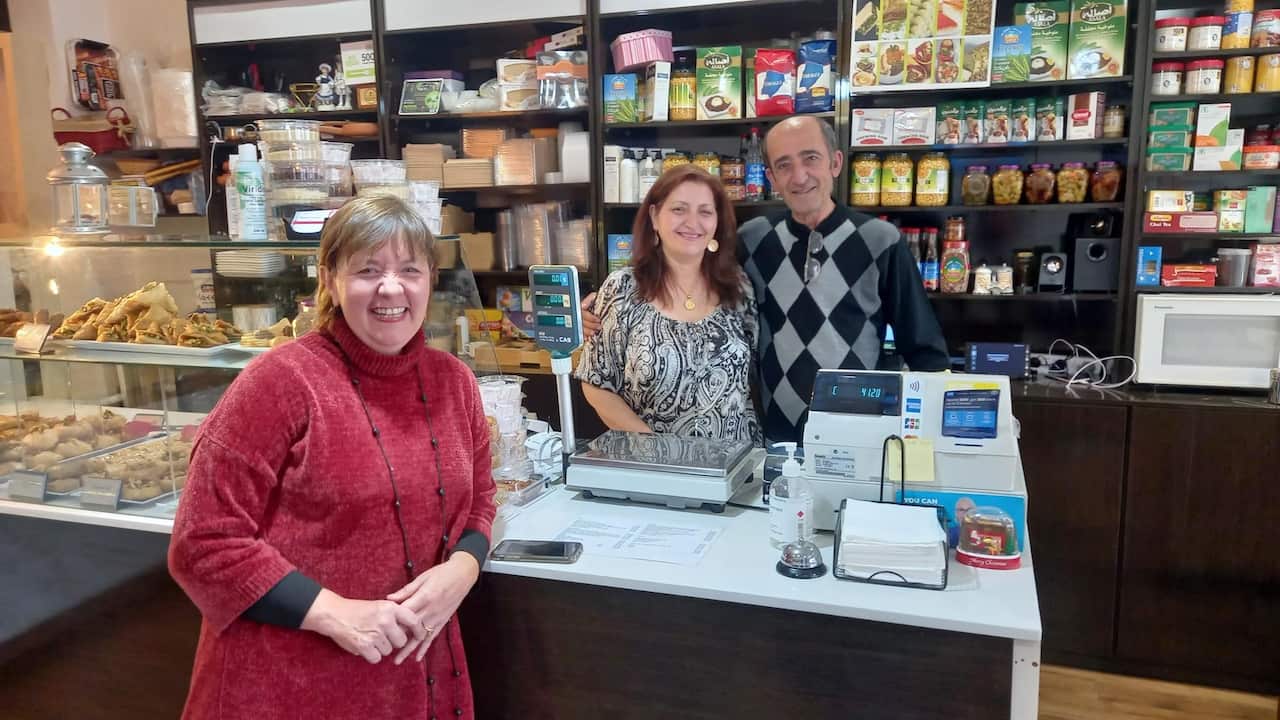 Co-founder of Migrant Women in Business Luz Restrepo at the family run business Trio Syrian Cuisine with refugees Joumana Charaf and Akram Abou Hamdan.