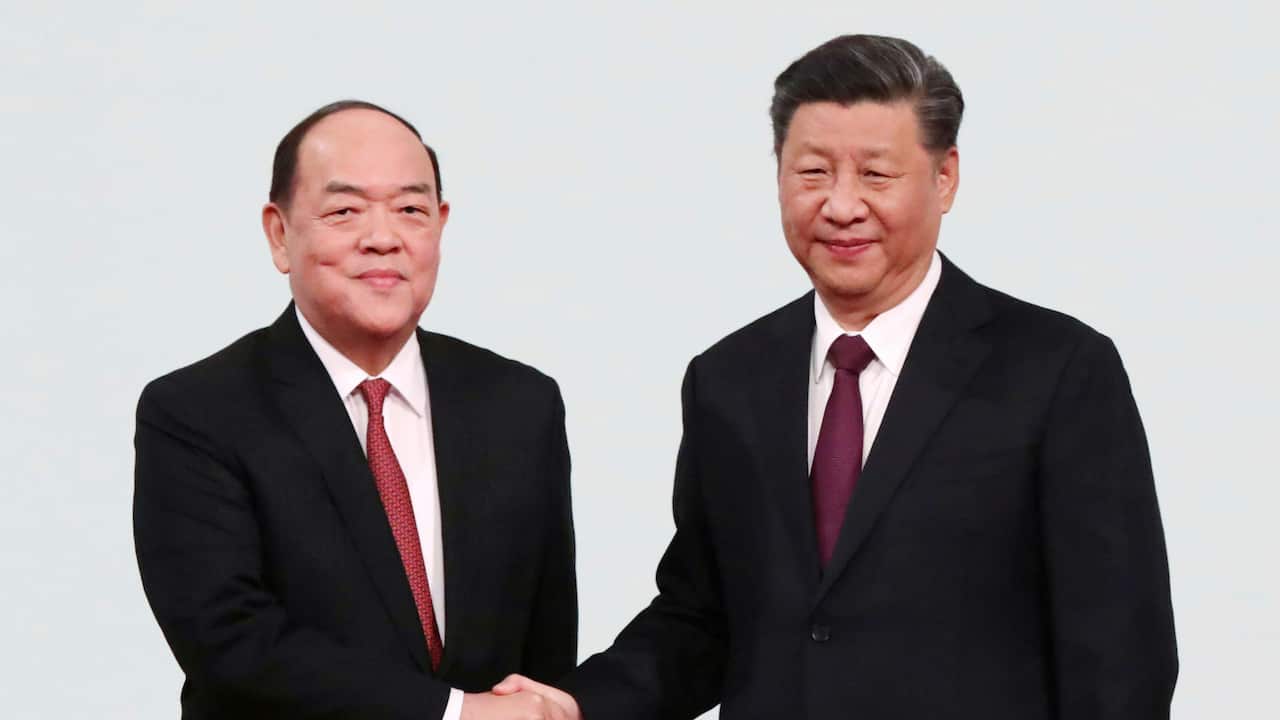 Chinese President Xi Jinping shakes hands with Chief Executive of Macau Ho Iat Seng during the 20th anniversary of Macau's return to China.