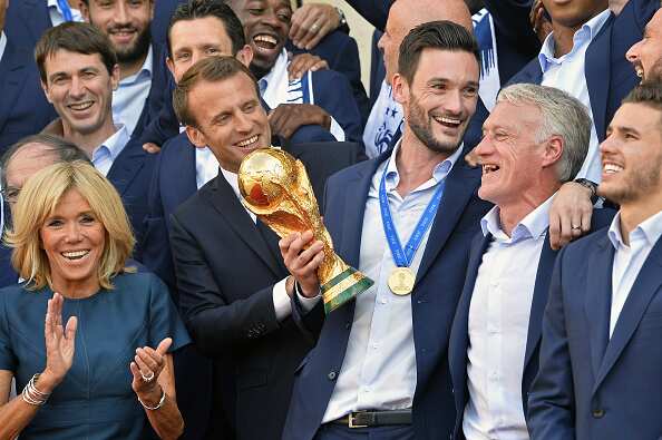 France Captain Hugo Lloris, French First Lady Brigitte Macron and Mr Macron with the World Cup.