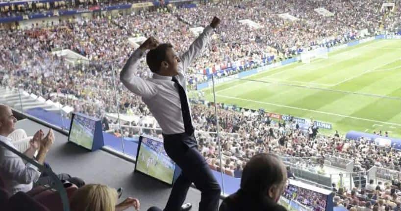 A jubilant looking President Macron pumps the air as France scores again.