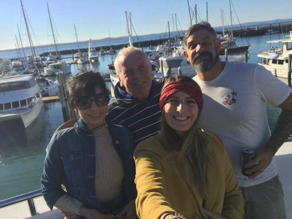 Madeline Hull (centre) and her parents (top left)