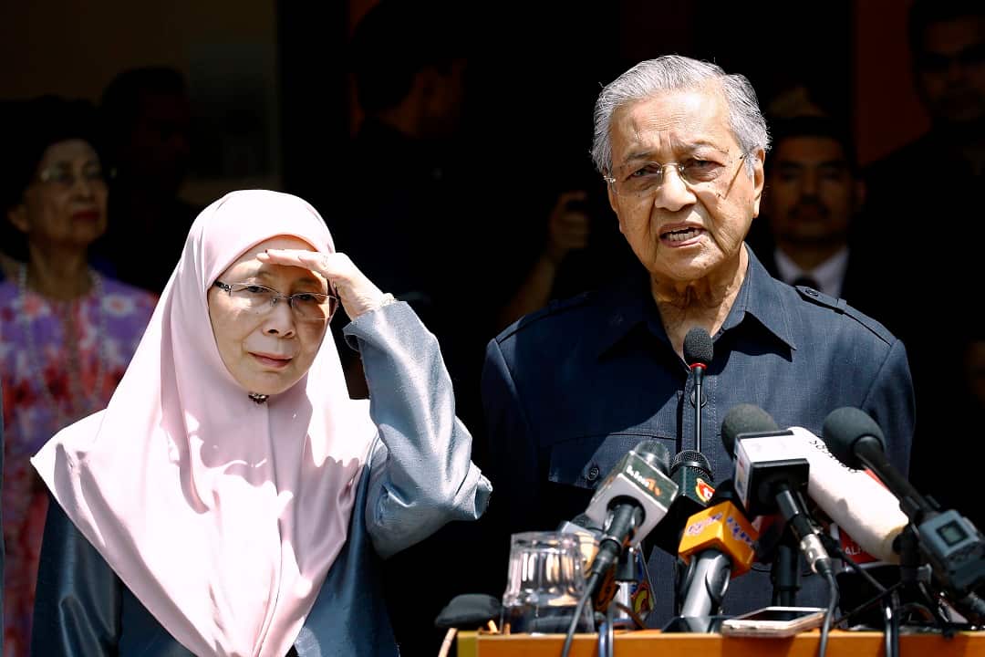 Malaysia's Prime Minister Mahathir Mohamad with Wan Azizah, wife of Anwar Ibrahim and Deputy Prime Minister-designate.