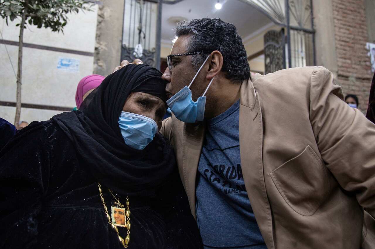 Al Jazeera journalist Mahmoud Hussein kisses his mother after being released from prison by the Egyptian authorities.