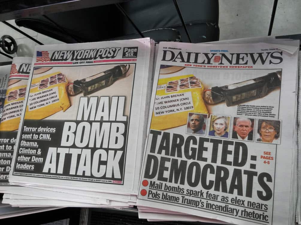 Headlines of the New York Daily News and Post newspapers use identical handout photographs on Thursday, October 25, 2018 to report on the makeshift pipe bombs that were mailed to various prominent Democrats.