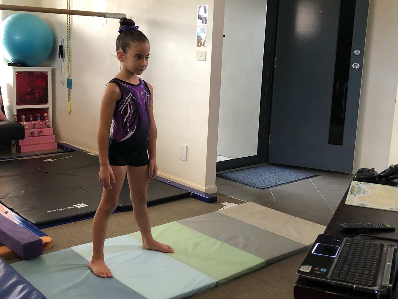 Makayla Gorgioski doing gymnastics at home