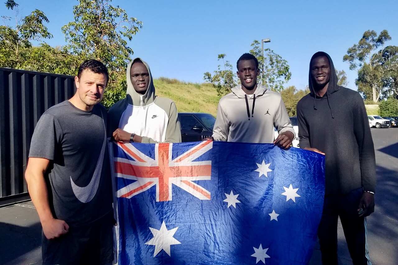 (L-R) Anthony Susnjara, Matur Maker, Makur Maker and Thon Maker pose for a photograph after a practice session in Los Angeles.
