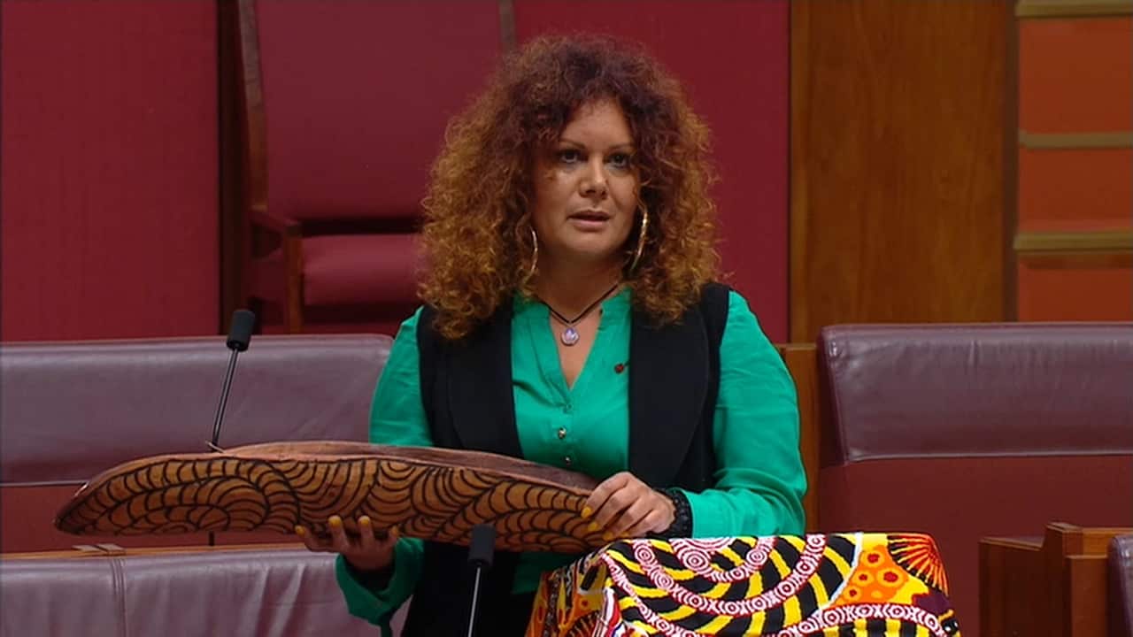 Labor Senator Malarndirri McCarthy delivered the report in a wooden coolamon, an Indigenous carrier for babies.